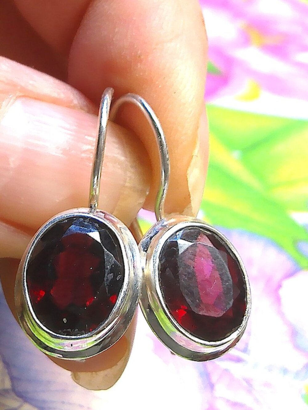 Beautiful 925 sterling silver and faceted garnet earrings.